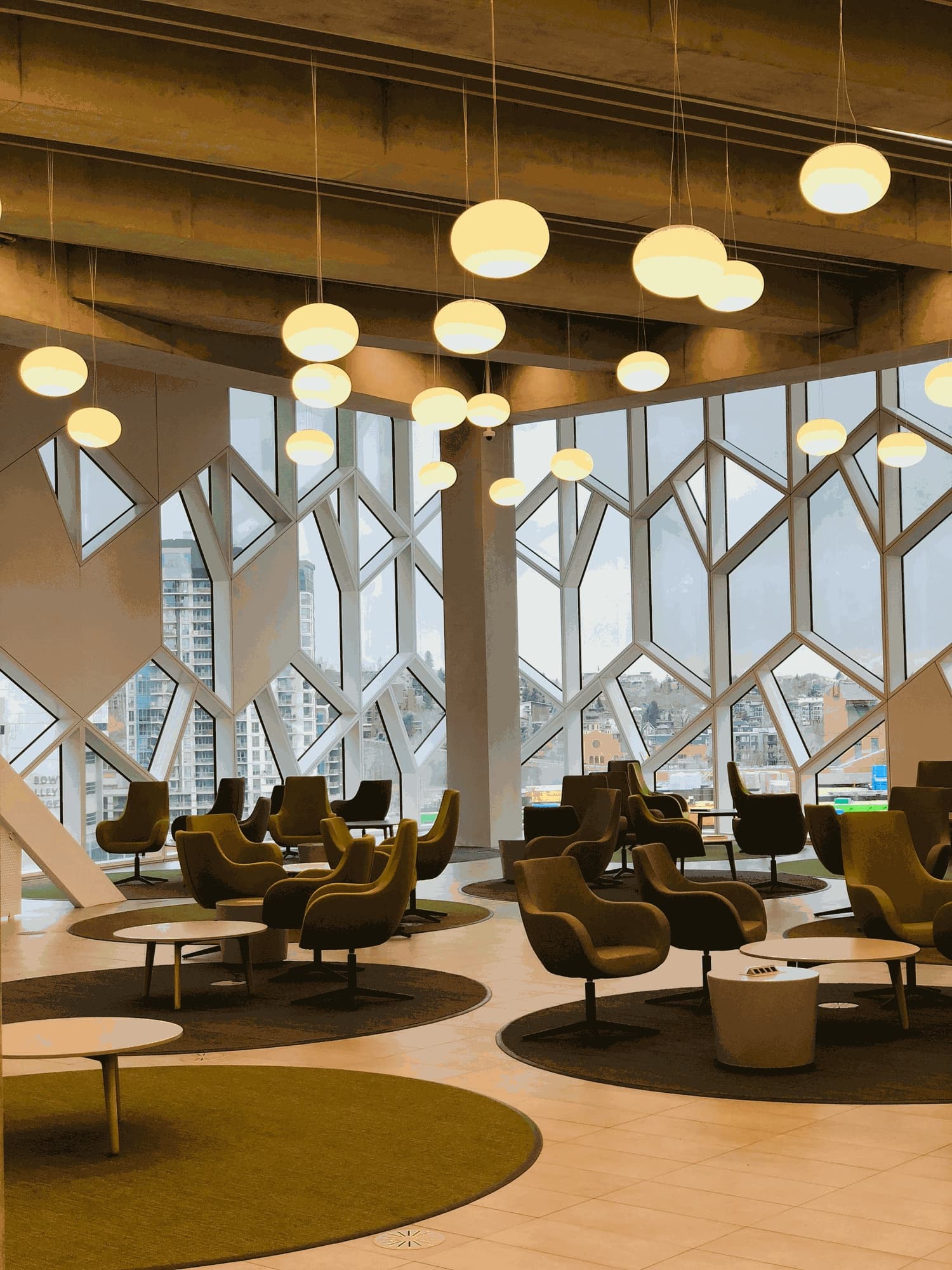 A lounge behind faceted glazing